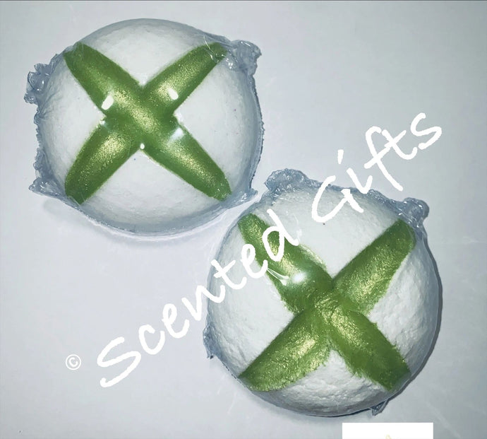 Xbox button bath bomb scented in green apple. White xbox button with green mica detail.