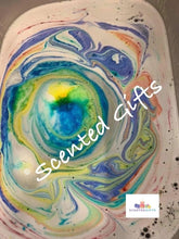 Load image into Gallery viewer, Unicorn jead shaped bath bomb scented in unicorn sparkles A fresh, juicy, sugar laden blend of papaya, peach, mandarin, raspberry, grape and pineapple, with sweet hints of coconut and jasmine all rolled up with white musk and amber. A white decorated bomb with coloured embeds.