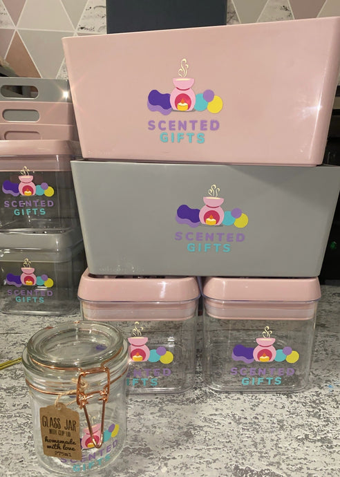 Scented Gifts Merch  Scented Gifts Logo merchandise. grey, pink tubs and glass.
