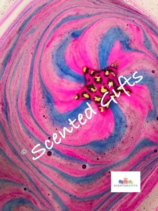bright pink Leopard star print star bomb bath scented in strawberry bon bon with pink ble embeds.