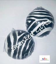 Load image into Gallery viewer, Zebra design round half bath bomb scented in strawberry with embeds