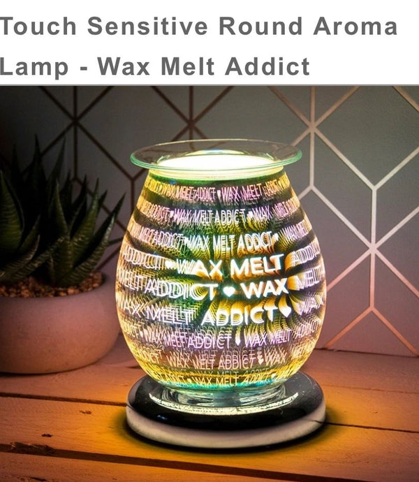 Touch Sensitive Round Aroma Lamp - Wax Melt Addict  Round Melt Burner / Aroma Lamp With Striking 3D Wax Melt Addict Design.  Acts As An Oil Warmer With A Glass Dish On Top That Is Included.  Touch Sensitive Turn On And Off By Simply Touching The Lamp.UK Mains Powered UK Mains Powered with Black Lead and Two Halogen Bulbs (One as a Spare).  Individually Gift Boxed.The Touch Sensitive Feature Has 3 Light Settings, Enabling You To Switch Between Different Light Intensities with Just The Touch Of Your Finger!  
