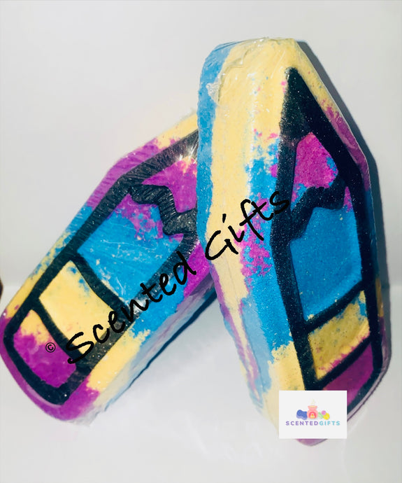 A triple layered coloured jumbo pencil shaped bath bomb scented in lovely spell.   