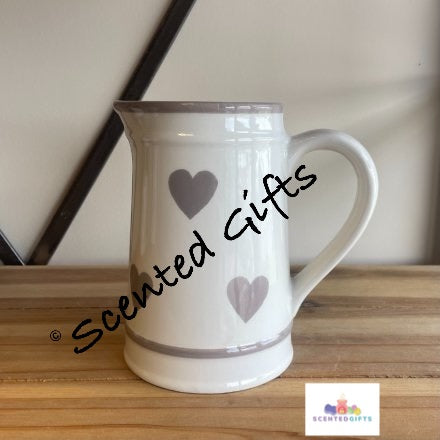 A beautiful and classic ceramic jug with a washed grey heart pattern.  A must have for displaying your favourite blooms and for showcasing on your table and in the home.  Dimensions are 11.00 (W) x 16.00 (H) x 15.00 (L) cm  
