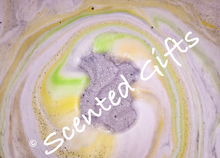 Load image into Gallery viewer, Cyril Squirrel A Grey squirrel bomb with hidden orange yellow and green centre fragranced in rhubarb and custard.
