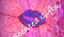 Load image into Gallery viewer, Sweet Jumbo Kisses bath bomb scented in fruity fizzes bubbles. Colours include purple lip with pink mica detail and coloured embeds.
