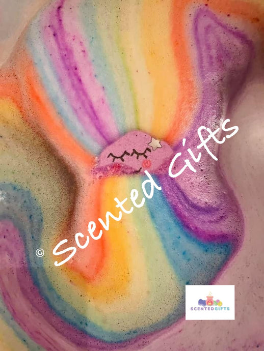 bedtime baby bath bomb scented in bedtime bath with rainbow coloured  embeds.