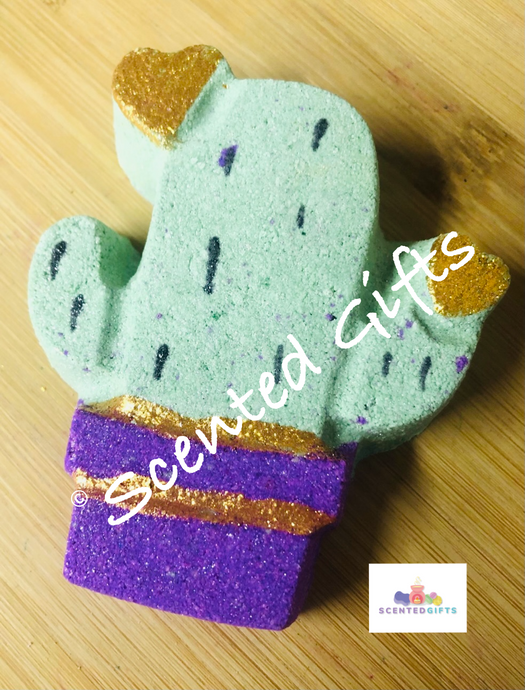 Cactus shaped bath bomb, coloured Green and pink with gold mica hearts and a silver shimmer. Fragranced in the high street dupe jpp classique women.