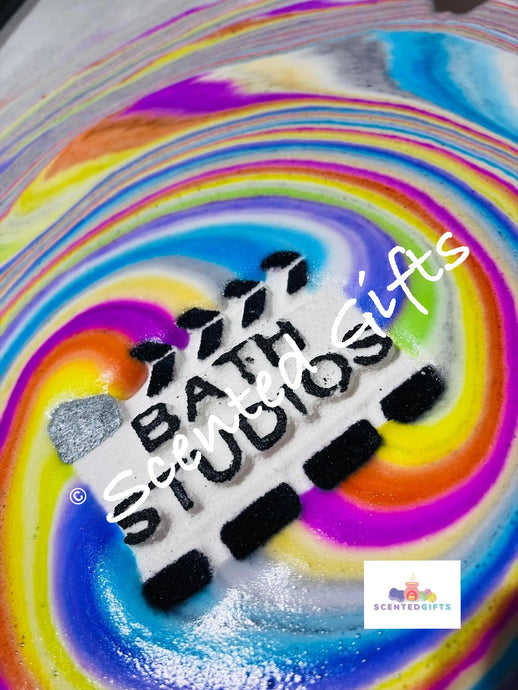 Bath Studios bath bomb  A white and black bath studios action shaped bath bomb scented in fruity and fun raspberry crush fragrance with hidden rainbow colours. Weighing in at 200g approx.