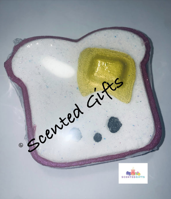 Cute Toast Bath Bomb   Cute toast shaped bath bomb with hand painted detail Purple colours inside Scented in baby powder.